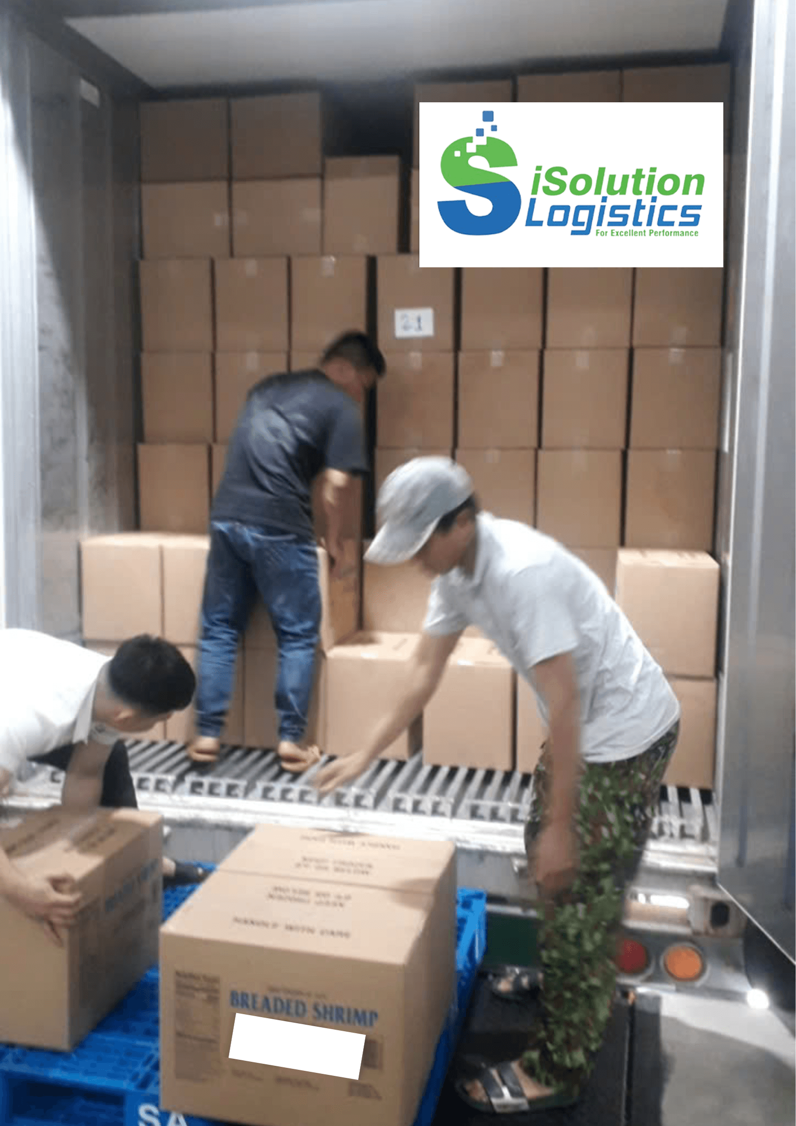 Workers loading cartons into a reefer container, iSolution Logistics