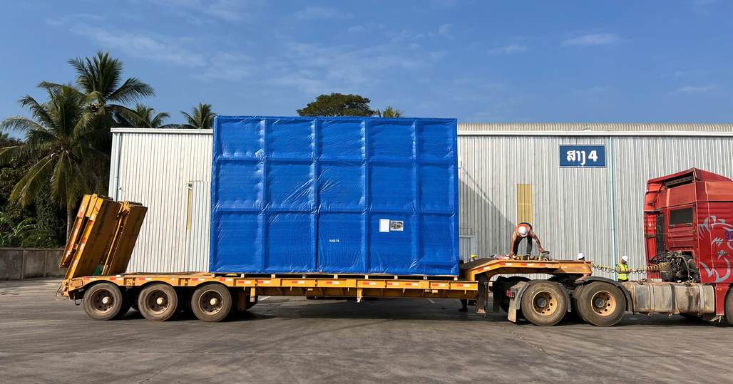 Trucks hauling blue cargo crates handled by iSolution Logistics